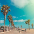 Boardwalk of Venince beach with palms vintage toned image, Los Angeles