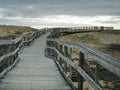 Boardwalk wood trail leads across sand dunes of Plum Island