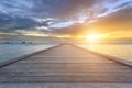 Boardwalk or wooden bridge to the sea at sunset beach in Koh Sam Royalty Free Stock Photo