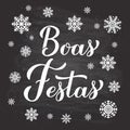 Boas Festas calligraphy hand lettering on chalkboard background with snowflakes. Happy Holidays in Portuguese. Christmas Royalty Free Stock Photo