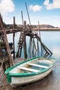 Boat aground and a pier Royalty Free Stock Photo