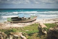 Boat aground on rocky beach, Isla Mujeres, Mexico. Royalty Free Stock Photo
