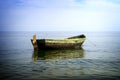 Boat at anchor in sea high contrasted