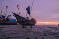 The boat anchored on the river bank is waiting for the tide