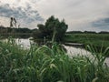 Boat on the background of the lake grass and wood