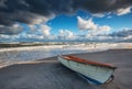 Boat on the beach at sunrise time Royalty Free Stock Photo