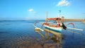 Boat on beach in sunset time at low tide Royalty Free Stock Photo