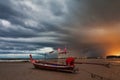 Boat on the beach at sunset Royalty Free Stock Photo