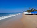 boat on the beach, tropical beach, clean water and blue sky Goa beach, Indian ocean beach. fishing boat in beach.