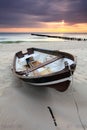 Boat on beautiful beach in sunrise Royalty Free Stock Photo
