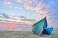 Boat on beautiful beach in sunrise Royalty Free Stock Photo