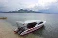 Boat is being anchored at Siladen beach in North Sulawesi, Indonesia.