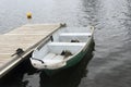 Boat on black lake on cloudy day