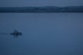 Boat at blue hour. Motorboat alone in the lake during blue twilight hour in Constanta, Romania Royalty Free Stock Photo