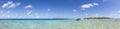 Boat on blue lagoon panoramic view Royalty Free Stock Photo