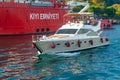 Boat in Bosphorus. Boat sails past a pier with a rescue ship in the Bosphorus. Istanbul. Turkey. 09/25/2021 Royalty Free Stock Photo