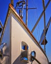 Boat Bow From Sailboat Under Blue Sky With Anchor Chain And Winch Detail
