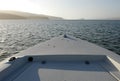 Boat bow toward bay mouth Royalty Free Stock Photo