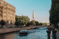 Boat on the canal in Saint Petersburg at sunset against the background of the chapel, August 20, 2020 Royalty Free Stock Photo