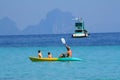 Boat and canoe on the blue sea