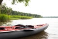 Boat , canoe-kayak on water , lake on background of green summer forest. Concept of sport leisure activities, recreation Royalty Free Stock Photo