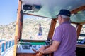 Boat captain controls ship. Yacht steering wheel and control panel. Ready to sea travel. Wooden deck interior of sailing Royalty Free Stock Photo