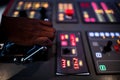 Boat captain hands navigating and moving instruments in the cockpit Royalty Free Stock Photo