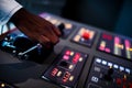 Boat captain hands navigating and moving instruments in the cockpit Royalty Free Stock Photo