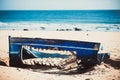 Boat carcass with Blue Paints on the Sandy Beach of Bolonia Spain with Ocean View Royalty Free Stock Photo