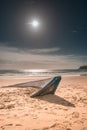 Boat carcass with Blue Paints on the Sandy Beach of Bolonia Spain with Sun Flare Royalty Free Stock Photo