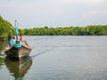 A boat carry tourist around Mangrove Waters in Mangrove Forest Conservation