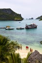 boat coastline of a green lagoon and people