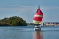 Boat with colorful sail