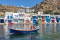 Boat Coloured houses in Klima beach with Trypiti village in background