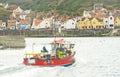 A boat coming into Staithes harbor. Royalty Free Stock Photo