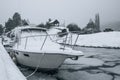 Boat covered in snow in winter
