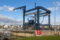 a boat crane lift on a marina use for lifting boats out of the water for repairs Royalty Free Stock Photo