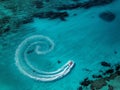 Boat Creating Spiral Wake in Turquoise Water Royalty Free Stock Photo