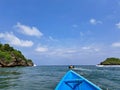 The boat crosses the river towards the sea