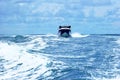 Boat crossin the sea at high speed. Waves shacking the waters Royalty Free Stock Photo