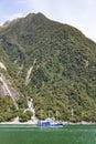 Boat cruising at Milford Sound in New Zealand. Royalty Free Stock Photo