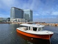 Vladivostok, Russia, July, 26, 2022. The boat of the CSKA Sports Society against the backdrop of the Hyatt Vladivostok, Burny hote