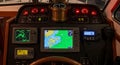 Boat dashboard featuring navigation equipment radar compass and communication devices onboard Royalty Free Stock Photo