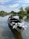 Boat decorated with white flowers. Wedding boat on lake in summer time horizone Royalty Free Stock Photo