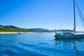 Boat diving in front of a beach of Cies Islands, in Galicia, Spa Royalty Free Stock Photo