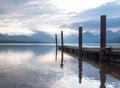 Boat Dock in Glacier National Park`s Lake McDonald with a Reflection in the Lake`s Ripples Royalty Free Stock Photo