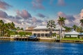 Boat on Dock by Intercoastal House Royalty Free Stock Photo