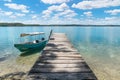 Boat at a dock at lake Itza with turquoise water, El Remate, Peten, Guatemala