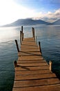 Boat dock on lake with volcano- Lake Atitlan, Guat Royalty Free Stock Photo
