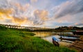 A boat dock for a river tour, built in a bamboo raft near an ancient wooden bridge in Sangkhlaburi District Royalty Free Stock Photo